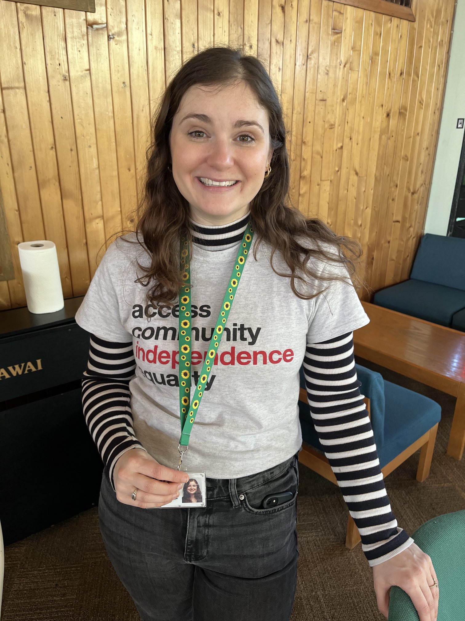 Campaigns and Communications Manager, Hallie with her hidden disabilities lanyard